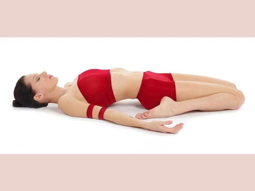 Reclining Hero Pose (Supta Virasana) — photograph
